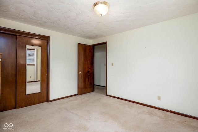 5749 Teresa Dr, Alexandria, IN 46001 - unfurnished bedroom featuring light carpet and a textured ceiling