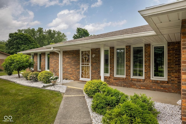 5749 Teresa Dr, Alexandria, IN 46001 - ranch-style home featuring brick siding, a shingled roof, and a front yard