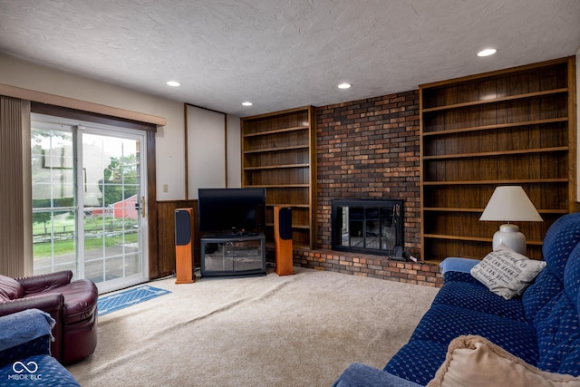 5749 Teresa Dr, Alexandria, IN 46001 - carpeted living room featuring a textured ceiling, wainscoting, built in features, wooden walls, and a fireplace