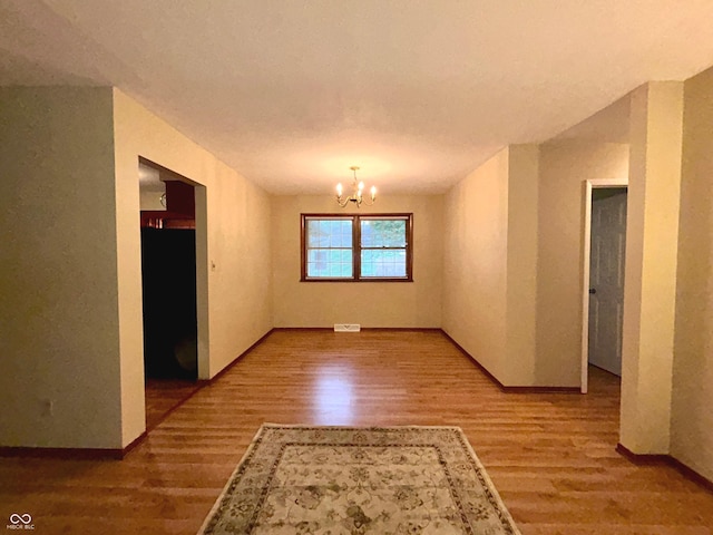 7721 Hollybrook Ln, Indianapolis, IN 46227 - unfurnished dining area with wood finished floors and a chandelier