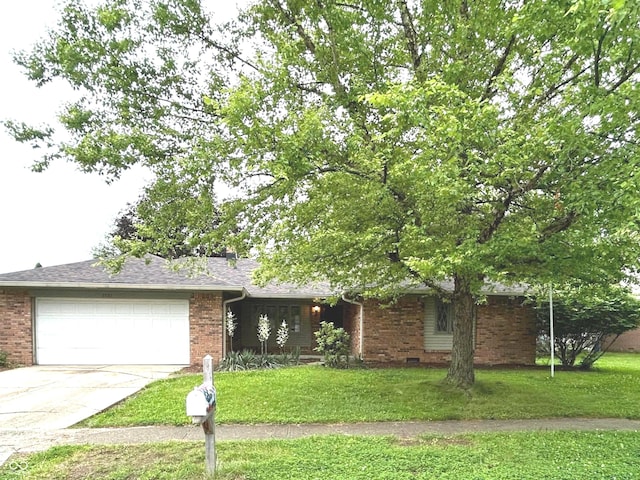 7721 Hollybrook Ln, Indianapolis, IN 46227 - view of front of house with a garage, brick siding, and concrete driveway