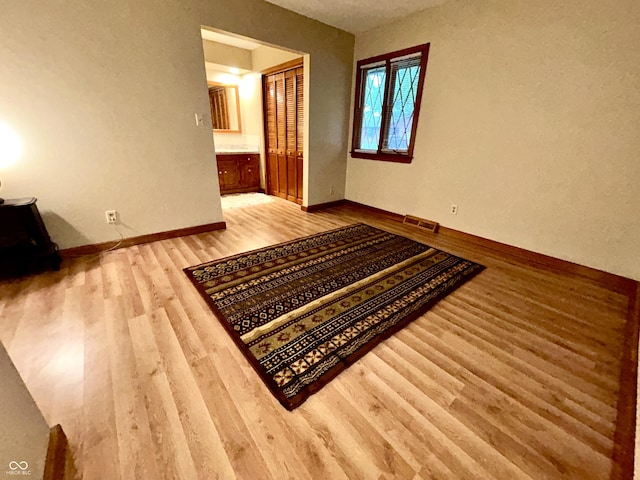 7721 Hollybrook Ln, Indianapolis, IN 46227 - spare room featuring wood finished floors and baseboards