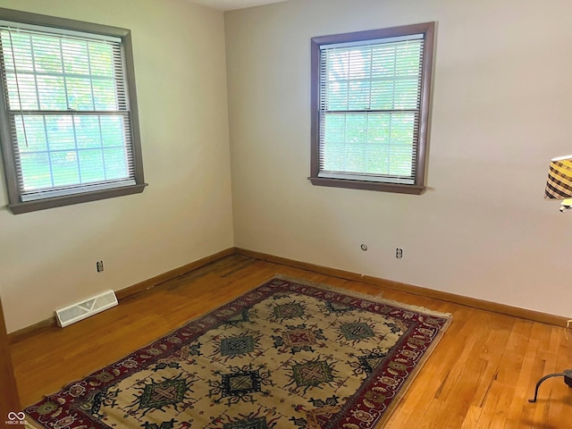 7721 Hollybrook Ln, Indianapolis, IN 46227 - spare room featuring wood finished floors and baseboards