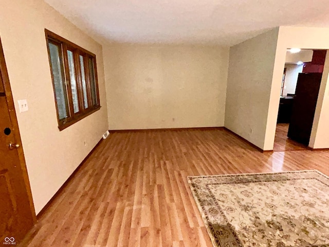 7721 Hollybrook Ln, Indianapolis, IN 46227 - unfurnished room with wood finished floors and baseboards