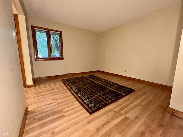 7721 Hollybrook Ln, Indianapolis, IN 46227 - unfurnished room featuring wood finished floors and baseboards