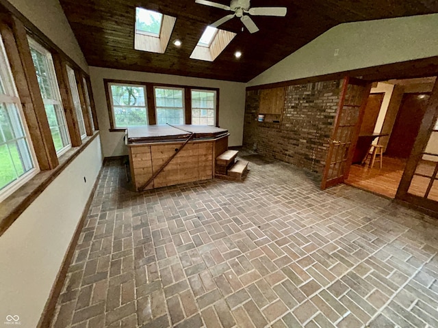7721 Hollybrook Ln, Indianapolis, IN 46227 - unfurnished sunroom featuring vaulted ceiling, a skylight, and a hot tub