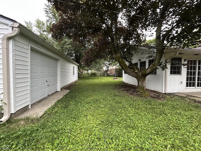 7721 Hollybrook Ln, Indianapolis, IN 46227 - view of green lawn featuring a garage