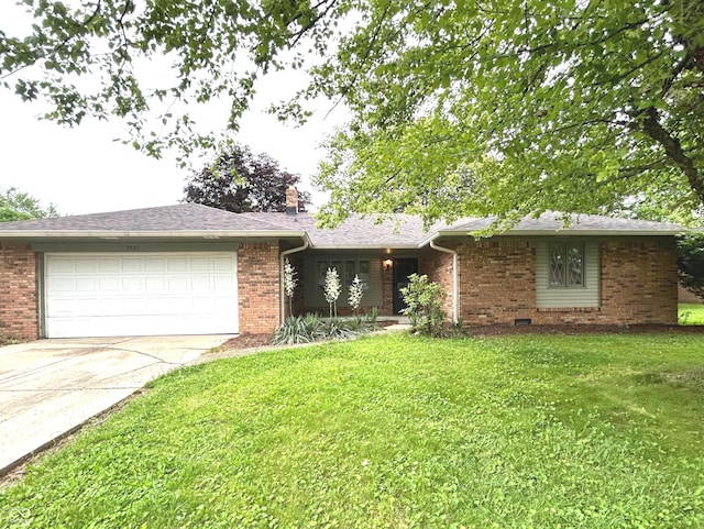 7721 Hollybrook Ln, Indianapolis, IN 46227 - single story home with an attached garage, driveway, a front lawn, and brick siding