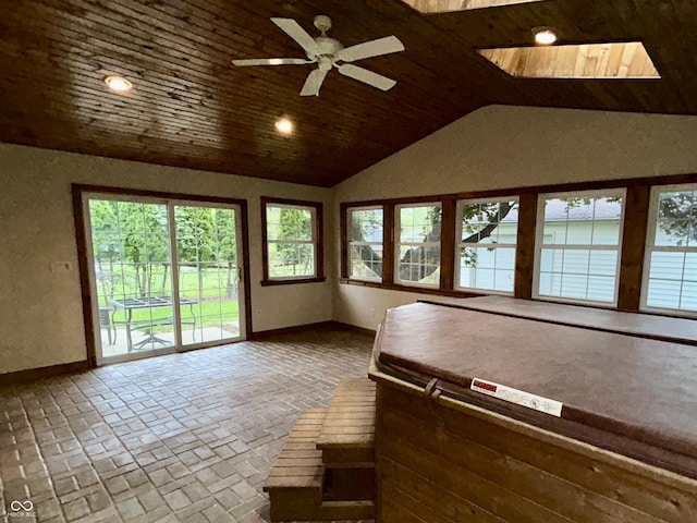 7721 Hollybrook Ln, Indianapolis, IN 46227 - sunroom featuring lofted ceiling, a jacuzzi, and a skylight