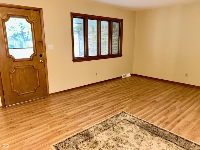 7721 Hollybrook Ln, Indianapolis, IN 46227 - foyer featuring wood finished floors and baseboards