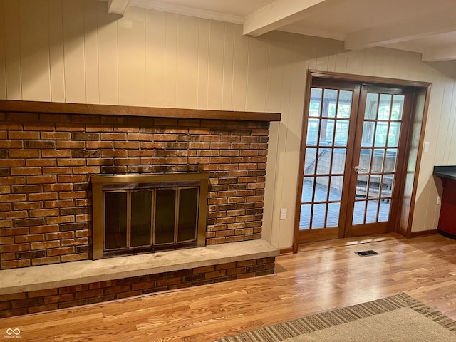 7721 Hollybrook Ln, Indianapolis, IN 46227 - detailed view of french doors, beam ceiling, wood finished floors, crown molding, and wood walls
