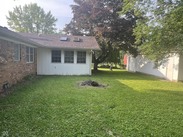 7721 Hollybrook Ln, Indianapolis, IN 46227 - view of green lawn with an outbuilding
