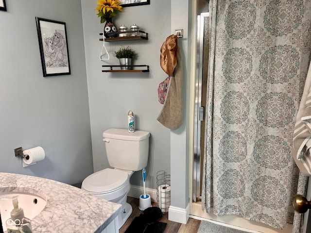 2213 Holden Dr, Anderson, IN 46012 - full bath featuring curtained shower, wood finished floors, and vanity