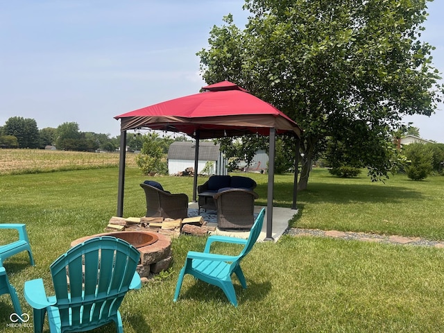 2213 Holden Dr, Anderson, IN 46012 - view of patio with an outdoor fire pit, a gazebo, and an outbuilding