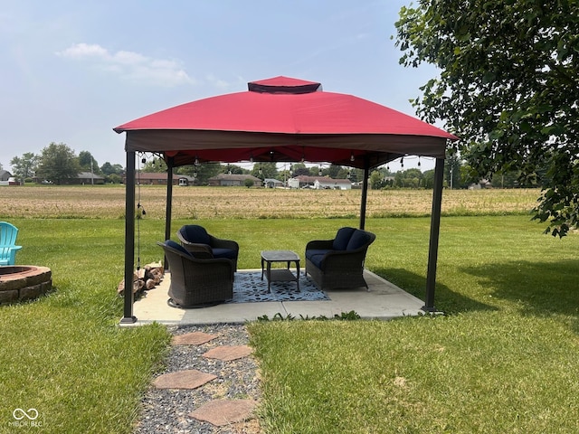 2213 Holden Dr, Anderson, IN 46012 - view of green lawn featuring a gazebo, a patio, and a fire pit