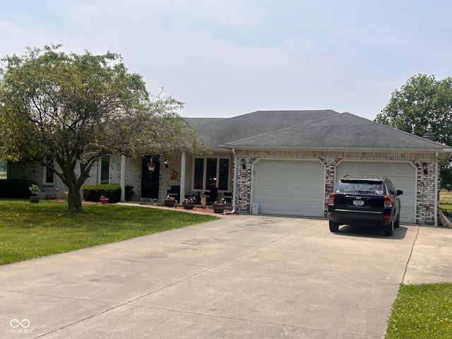 2213 Holden Dr, Anderson, IN 46012 - ranch-style house with driveway, an attached garage, a front yard, roof with shingles, and brick siding