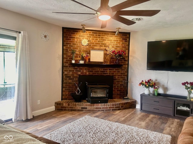 2213 Holden Dr, Anderson, IN 46012 - living area with wood finished floors, a ceiling fan, and a textured ceiling