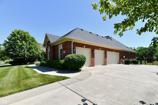 7413 Misty Woods Ln, Indianapolis, IN 46237 - view of property exterior featuring brick siding, a garage, driveway, and a shingled roof