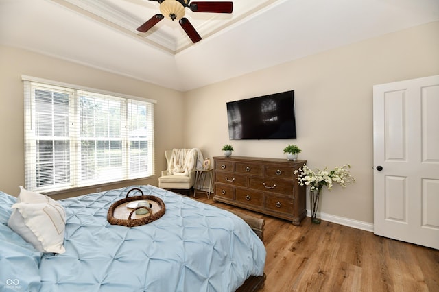 7413 Misty Woods Ln, Indianapolis, IN 46237 - bedroom featuring a tray ceiling, wood finished floors, crown molding, and a ceiling fan