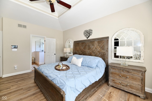 7413 Misty Woods Ln, Indianapolis, IN 46237 - bedroom featuring wood finished floors, a tray ceiling, a ceiling fan, and a towering ceiling