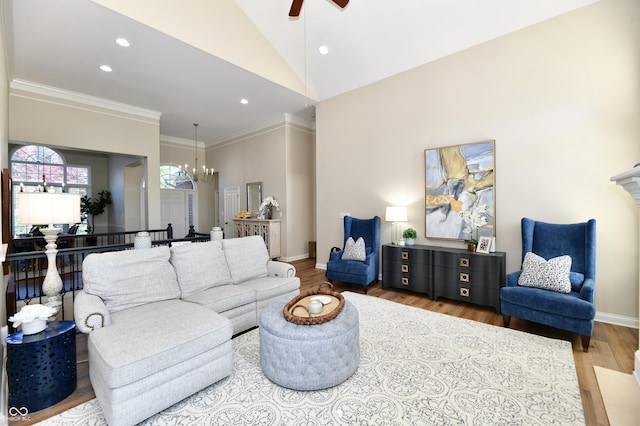 7413 Misty Woods Ln, Indianapolis, IN 46237 - living area featuring wood finished floors, a chandelier, a ceiling fan, recessed lighting, and crown molding