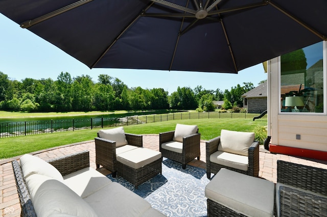 7413 Misty Woods Ln, Indianapolis, IN 46237 - fenced backyard featuring an outdoor living space, a water view, a patio, and view of scattered trees