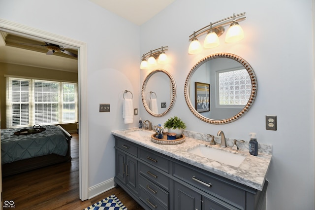 7413 Misty Woods Ln, Indianapolis, IN 46237 - ensuite bathroom featuring double vanity, wood finished floors, and a ceiling fan