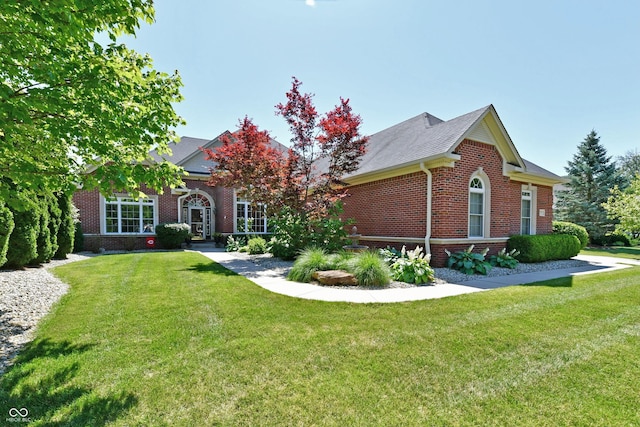 7413 Misty Woods Ln, Indianapolis, IN 46237 - view of front facade featuring brick siding and a front lawn
