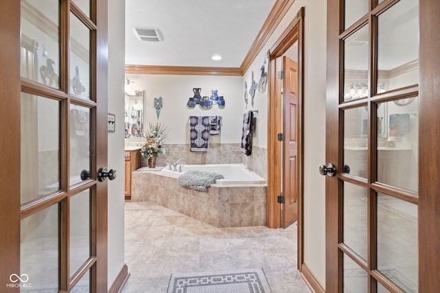6980 White Oak Dr, Avon, IN 46123 - bathroom featuring french doors, crown molding, a bath, and tile patterned floors