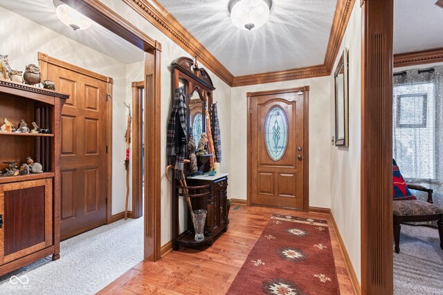 6980 White Oak Dr, Avon, IN 46123 - entrance foyer with light wood finished floors and crown molding