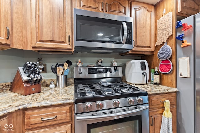 6980 White Oak Dr, Avon, IN 46123 - kitchen featuring appliances with stainless steel finishes and brown cabinets