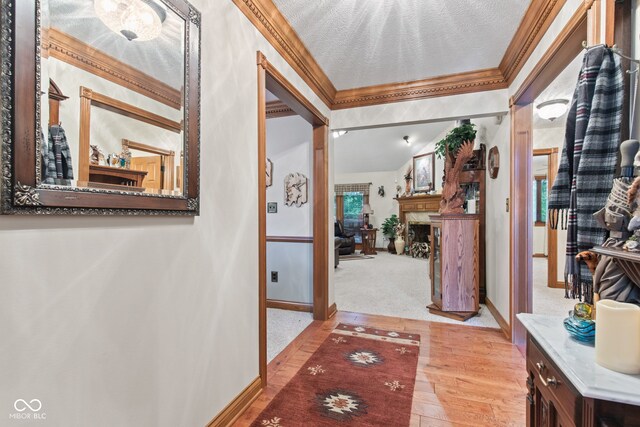 6980 White Oak Dr, Avon, IN 46123 - hallway with ornamental molding and wood finished floors