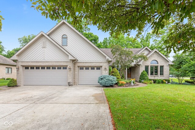 6980 White Oak Dr, Avon, IN 46123 - view of front of house featuring a garage, driveway, brick siding, and a front lawn