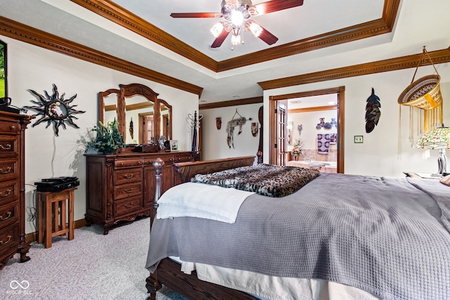 6980 White Oak Dr, Avon, IN 46123 - bedroom with light colored carpet, a tray ceiling, ornamental molding, a ceiling fan, and connected bathroom