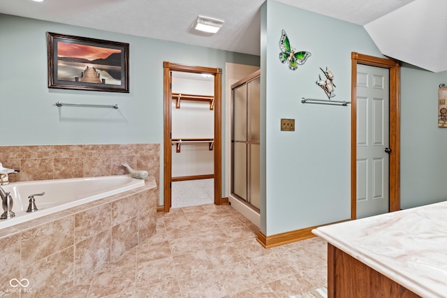 6980 White Oak Dr, Avon, IN 46123 - full bathroom with a bath, a shower stall, a spacious closet, and vanity