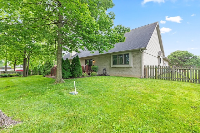 6980 White Oak Dr, Avon, IN 46123 - view of front of house featuring brick siding, a fenced backyard, and a shingled roof