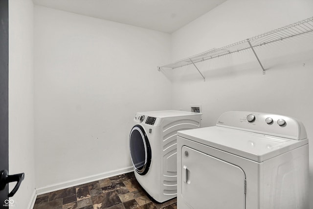 773 Bracknell Dr, Avon, IN 46123 - laundry room with separate washer and dryer and dark stone finish flooring