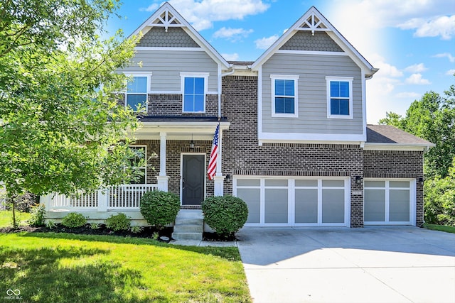773 Bracknell Dr, Avon, IN 46123 - view of front facade with brick siding, driveway, a front yard, and covered porch