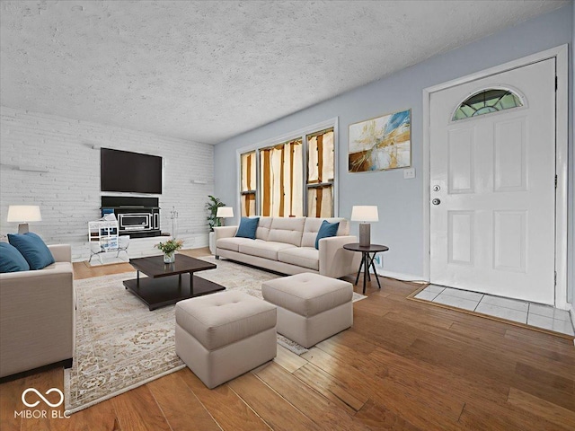 7422 E 33rd St, Indianapolis, IN 46226 - living area featuring wood finished floors and a textured ceiling