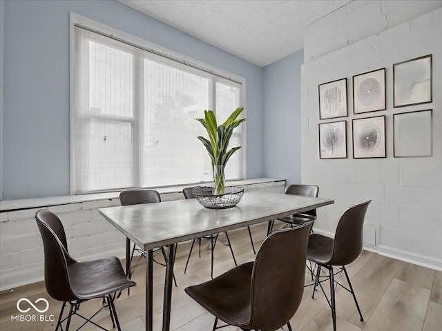 7422 E 33rd St, Indianapolis, IN 46226 - dining area featuring light wood-style floors and a textured ceiling