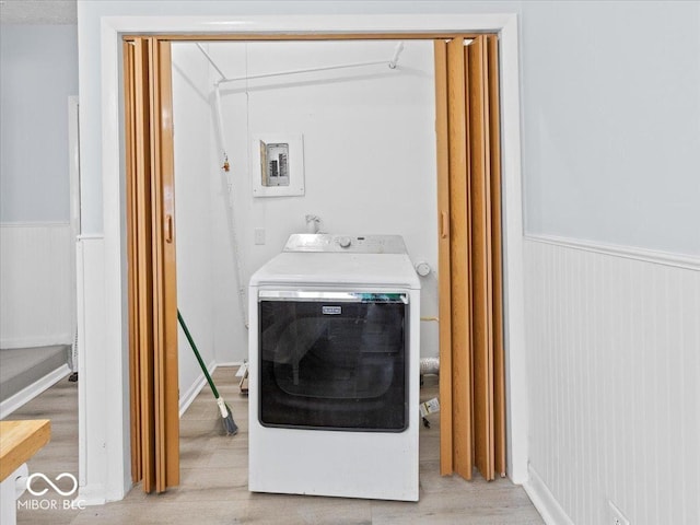 7422 E 33rd St, Indianapolis, IN 46226 - washroom featuring washer / clothes dryer, a wainscoted wall, light wood-style flooring, and electric panel