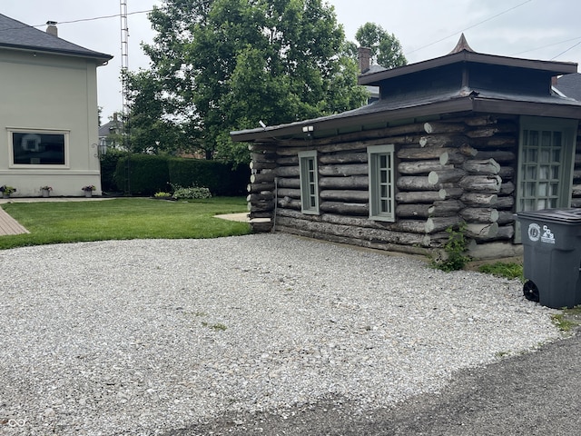 1131 N Main St, Rushville, IN 46173 - view of home's exterior with a yard and log exterior