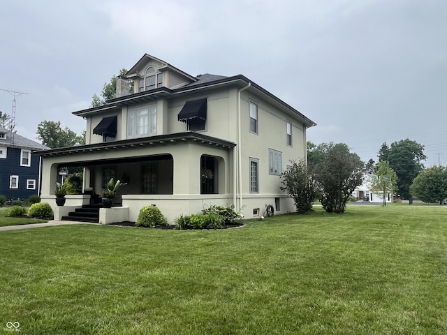 1131 N Main St, Rushville, IN 46173 - view of home's exterior featuring stucco siding and a yard