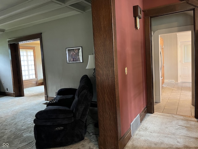 1131 N Main St, Rushville, IN 46173 - corridor featuring light carpet, beam ceiling, and light tile patterned floors