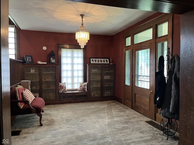 1131 N Main St, Rushville, IN 46173 - foyer entrance with carpet and a chandelier