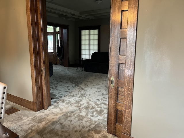 1131 N Main St, Rushville, IN 46173 - corridor featuring carpet flooring, plenty of natural light, coffered ceiling, and beamed ceiling
