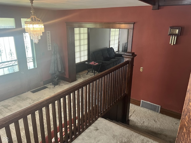 1131 N Main St, Rushville, IN 46173 - stairs with a chandelier, healthy amount of natural light, and carpet