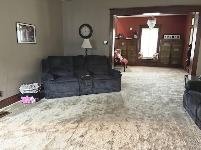 1131 N Main St, Rushville, IN 46173 - living area featuring carpet and a chandelier