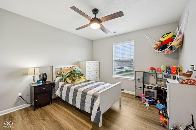 8126 Kilborn Way, Avon, IN 46123 - bedroom featuring wood finished floors and a ceiling fan