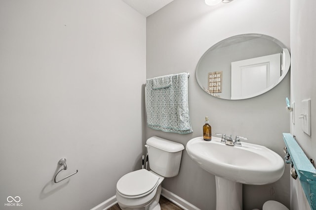 8126 Kilborn Way, Avon, IN 46123 - half bathroom with toilet and wood finished floors